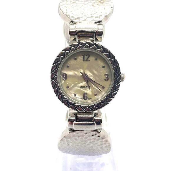 Women\'s silver dress watch. Ornate design on the bevel edge. Opalescent face. main image 6